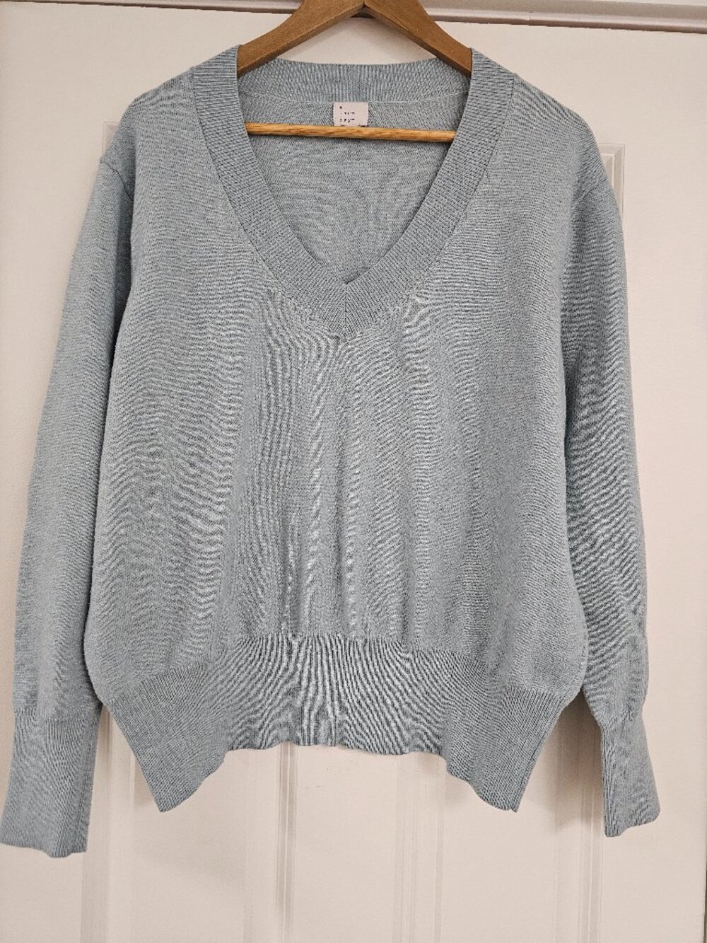 Women's V-neck long sleeve sweater in light teal blue, size XL